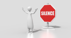 Figure with red "silence" stop sign